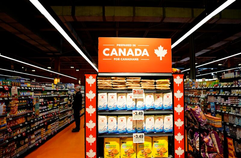 Products prepared in Canada are displayed prominently at the end of an aisle at a grocery store in Ottawa on April 2, 2025. (Justin Tang / The Canadian Press)